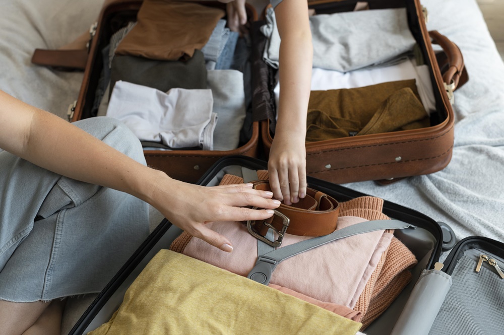 mother-and-son-preparing-suitcase-for-their-holiday